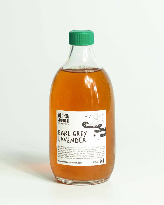 A 500ML bottle of Earl Grey Lavender Kombucha with a green cap against a clean white background.