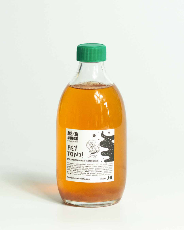 A 500ML bottle of Hey Tony! (Strawberry Mint Kombucha) with a green cap against a clean white background.