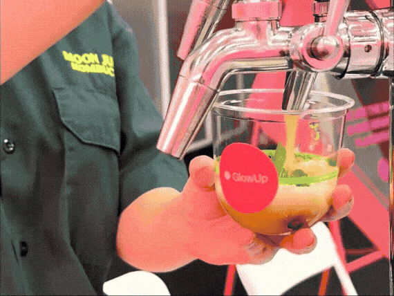 A gif compilation of cups being dispensed from our kombucha cart