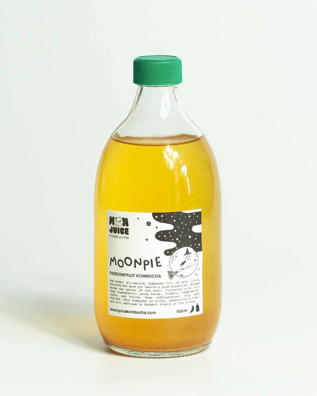 A 500ML bottle of Moonpie (Passionfruit Kombucha) with a green cap against a clean white background.