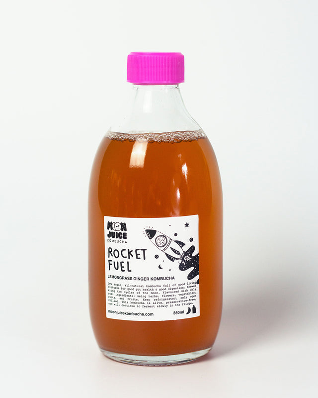 A 350ml bottle of Rocket Fuel (Lemongrass Ginger Kombucha) with a pink cap against a clean white background.