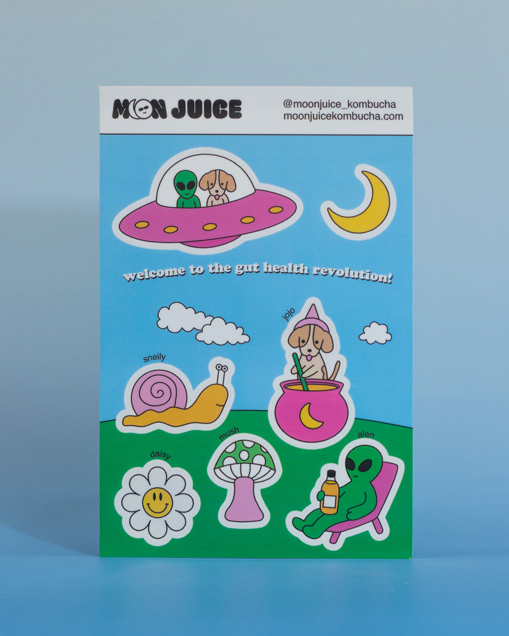 Sticker sheet with various Moon Juice Kombucha characters and text on a blue background