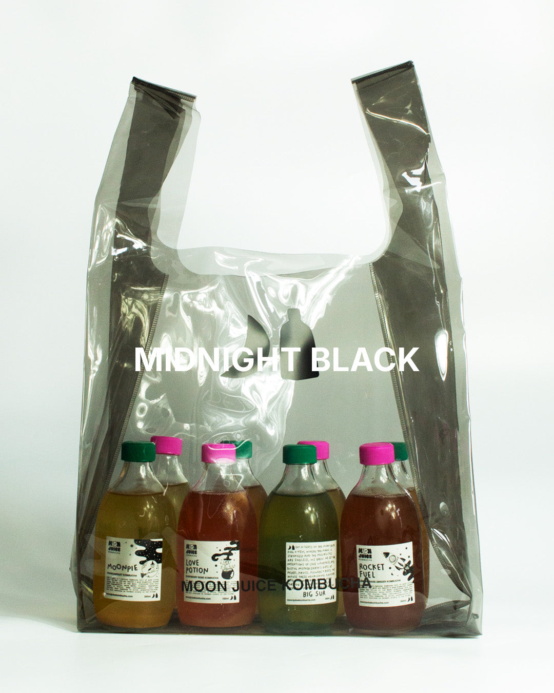 A translucent dark gray jellybag with printed 'MOON JUICE KOMBUCHA' text, shown against a plain white background. The bag contains 8 kombucha bottles.