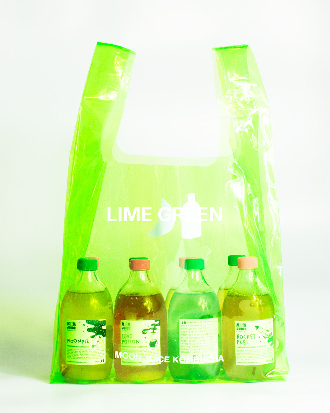 A translucent lime green jellybag with printed 'MOON JUICE KOMBUCHA' text, shown against a plain white background. The bag contains 8 kombucha bottles.