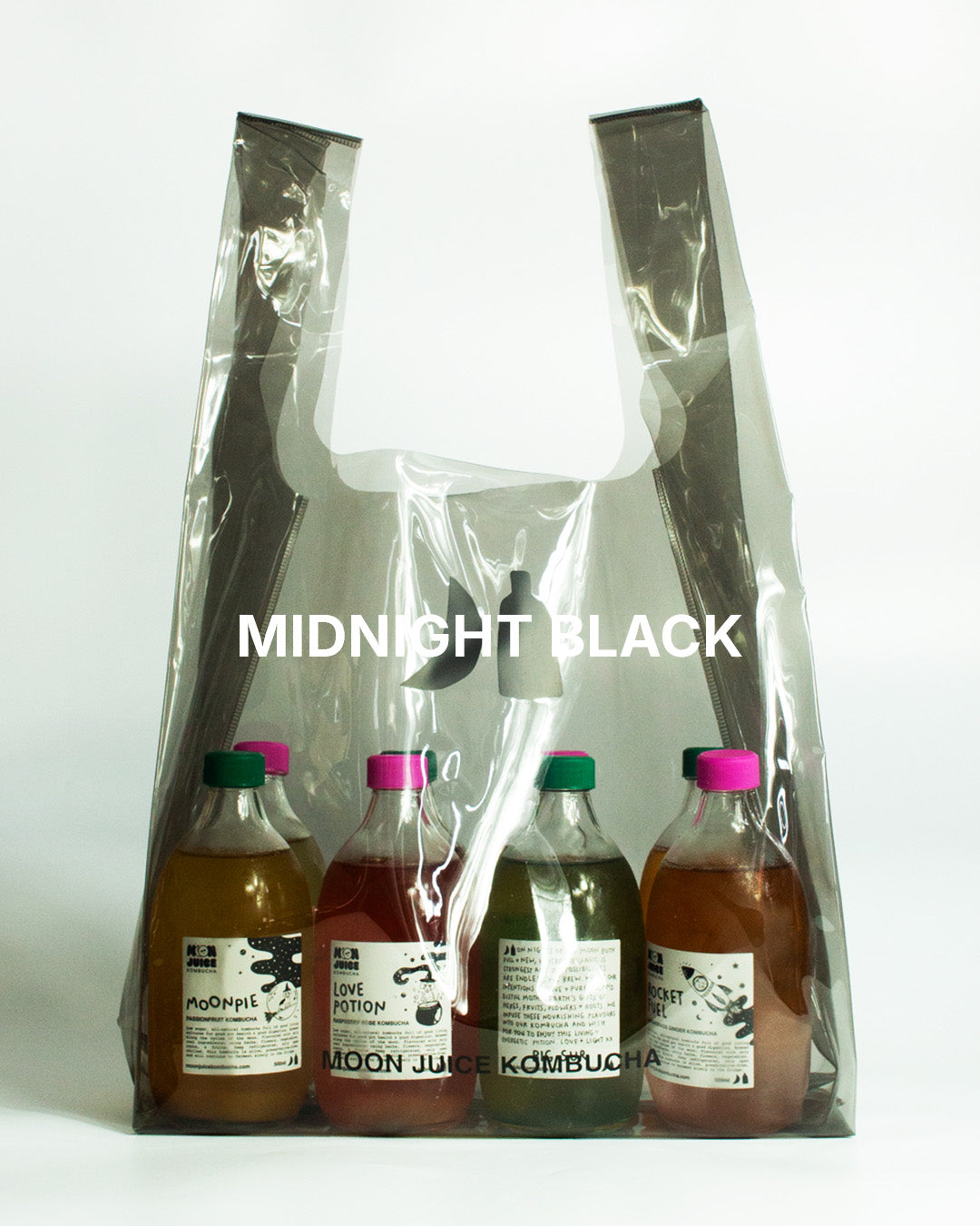 A translucent dark gray jellybag with printed 'MOON JUICE KOMBUCHA' text, shown against a plain white background. The bag contains 8 kombucha bottles.