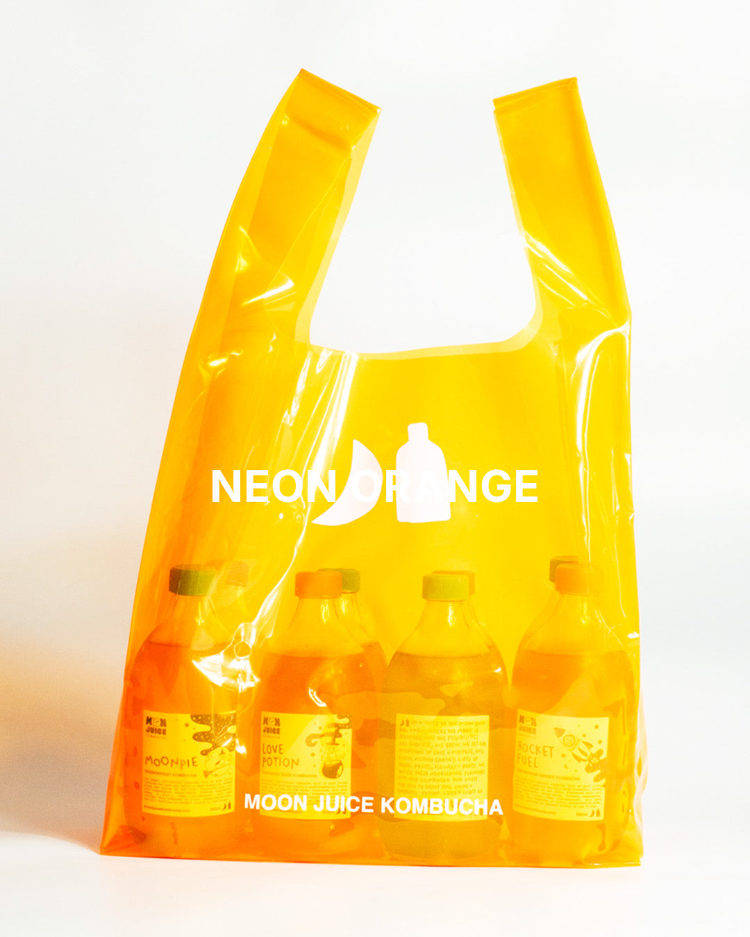 A translucent neon orange jellybag with printed 'MOON JUICE KOMBUCHA' text, shown against a plain white background. The bag contains 8 kombucha bottles.