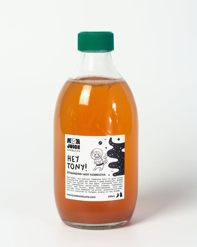 A 350ml bottle of Hey Tony! (Strawberry Mint Kombucha) with a green cap against a clean white background.