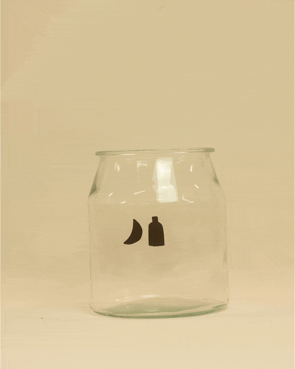 Stop-motion of a kombucha starter kit being unpacked — includes a glass jar, tea bags, SCOBY + starter tea, tea leaves + sugar, linen cloth + string, and 3 instruction sheets.