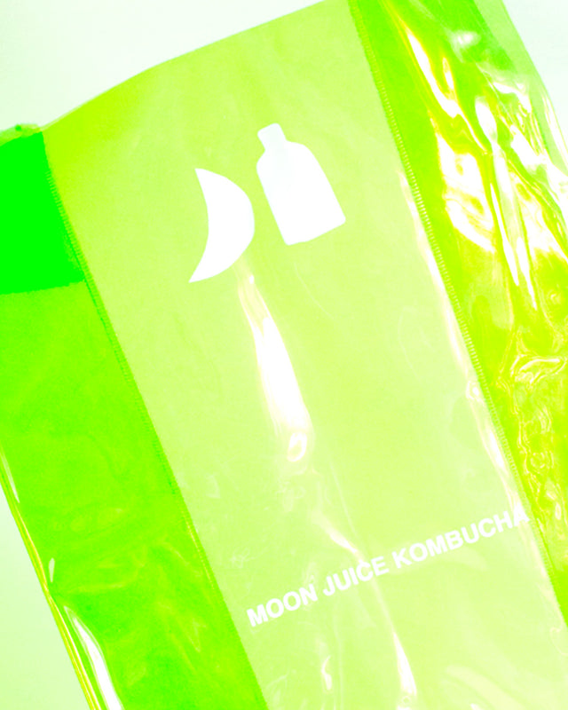 Neon green Moon Juice Kombucha jellybag with a white logo and text, photographed close up against a light background.