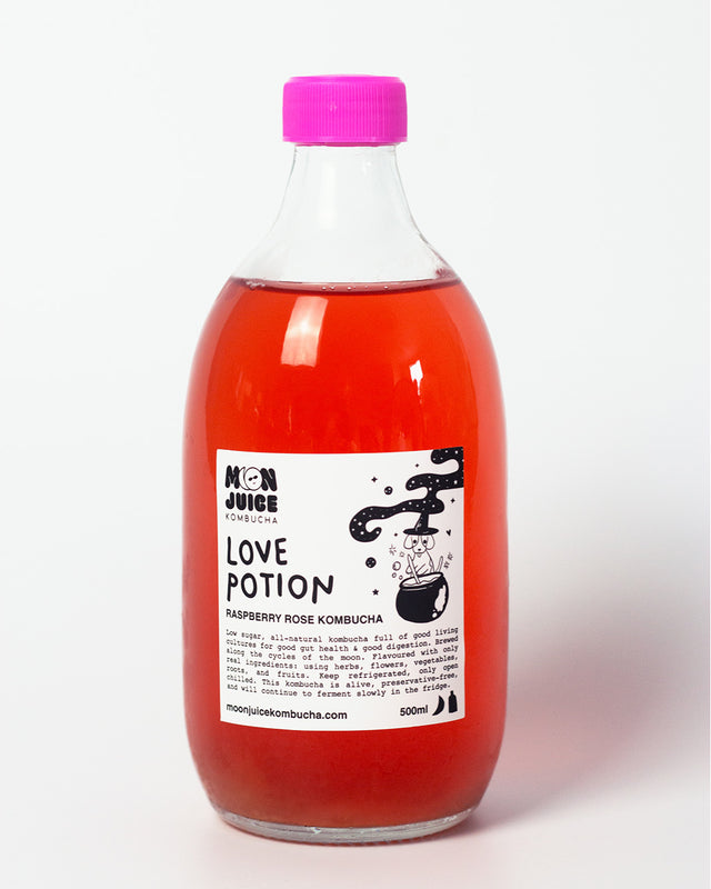A 500ML bottle of Love Potion (Raspberry Rose Kombucha) with a pink cap against a clean white background.