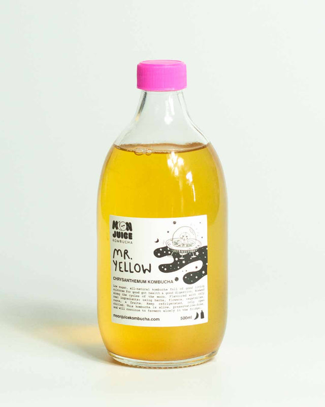 A 500ML bottle of Mr. Yellow (Chrysanthemum Kombucha) with a pink cap against a clean white background.